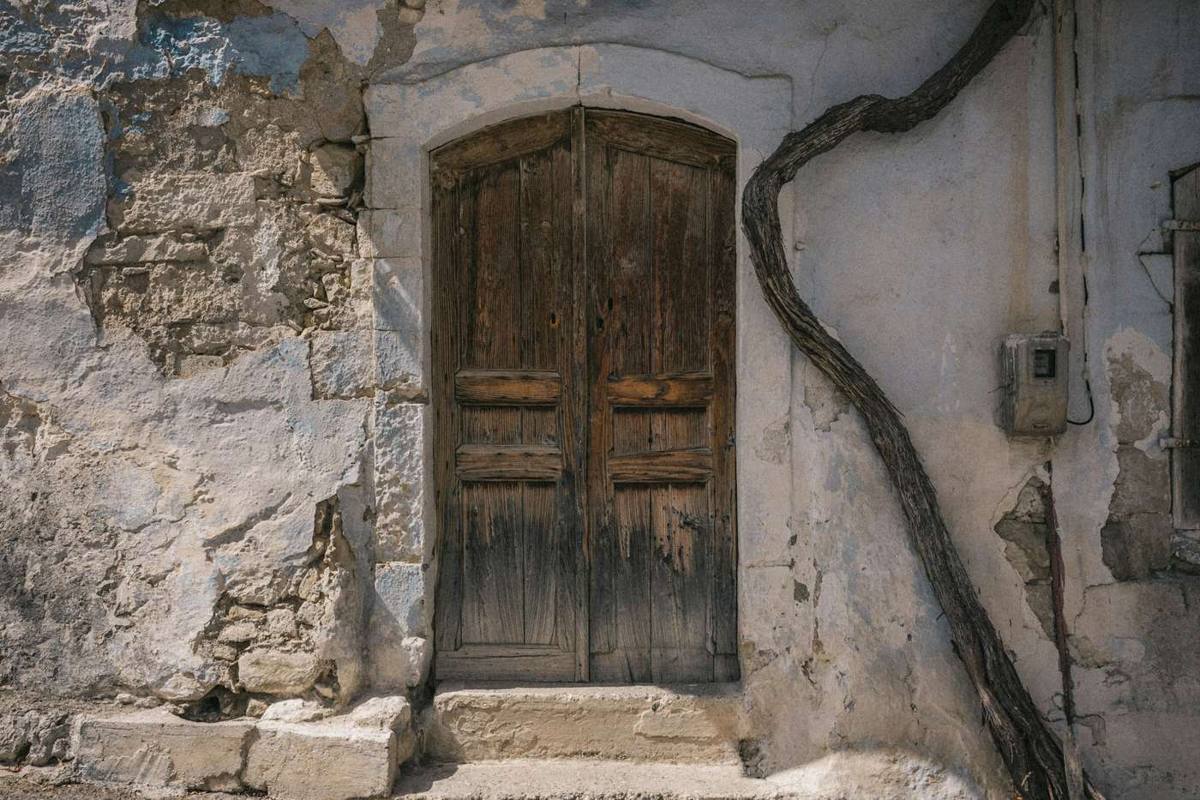 A narrow Stone Town alley with carved wooden doors